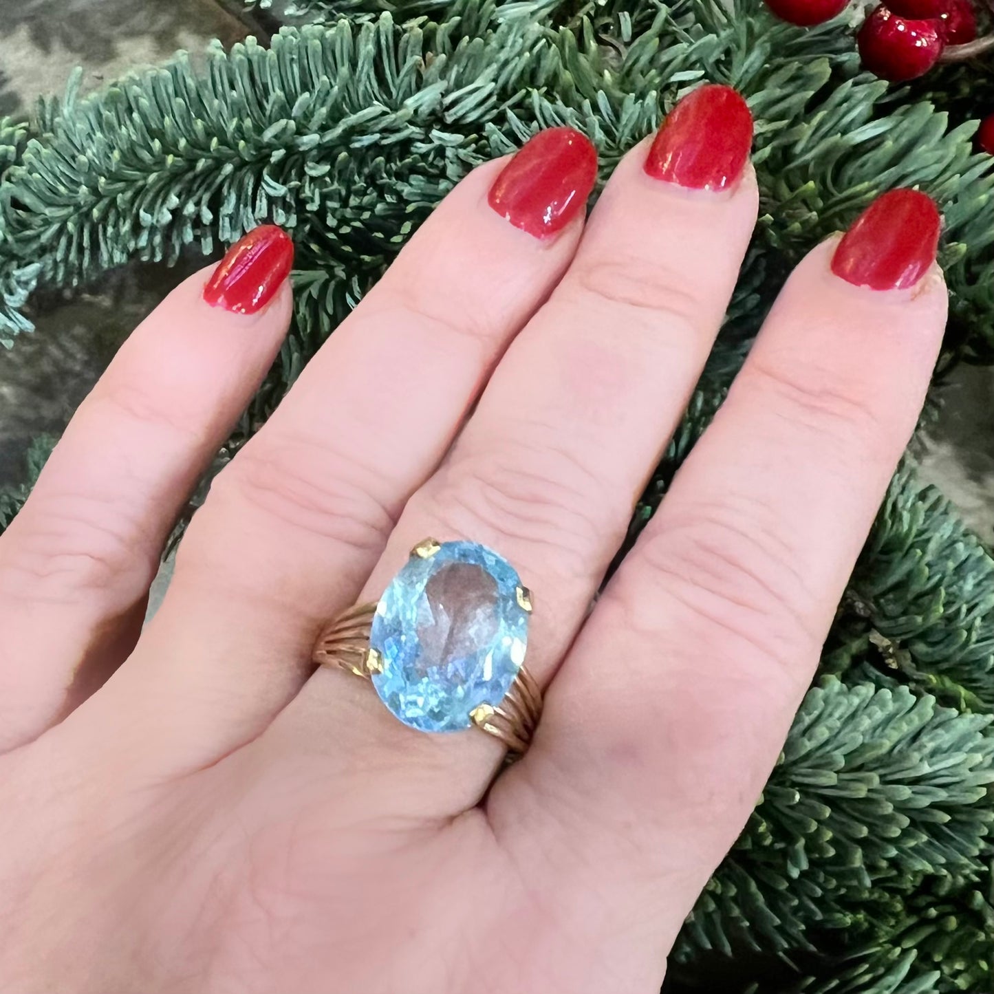 Cocktail ring with blue topaz and 14k yellow gold