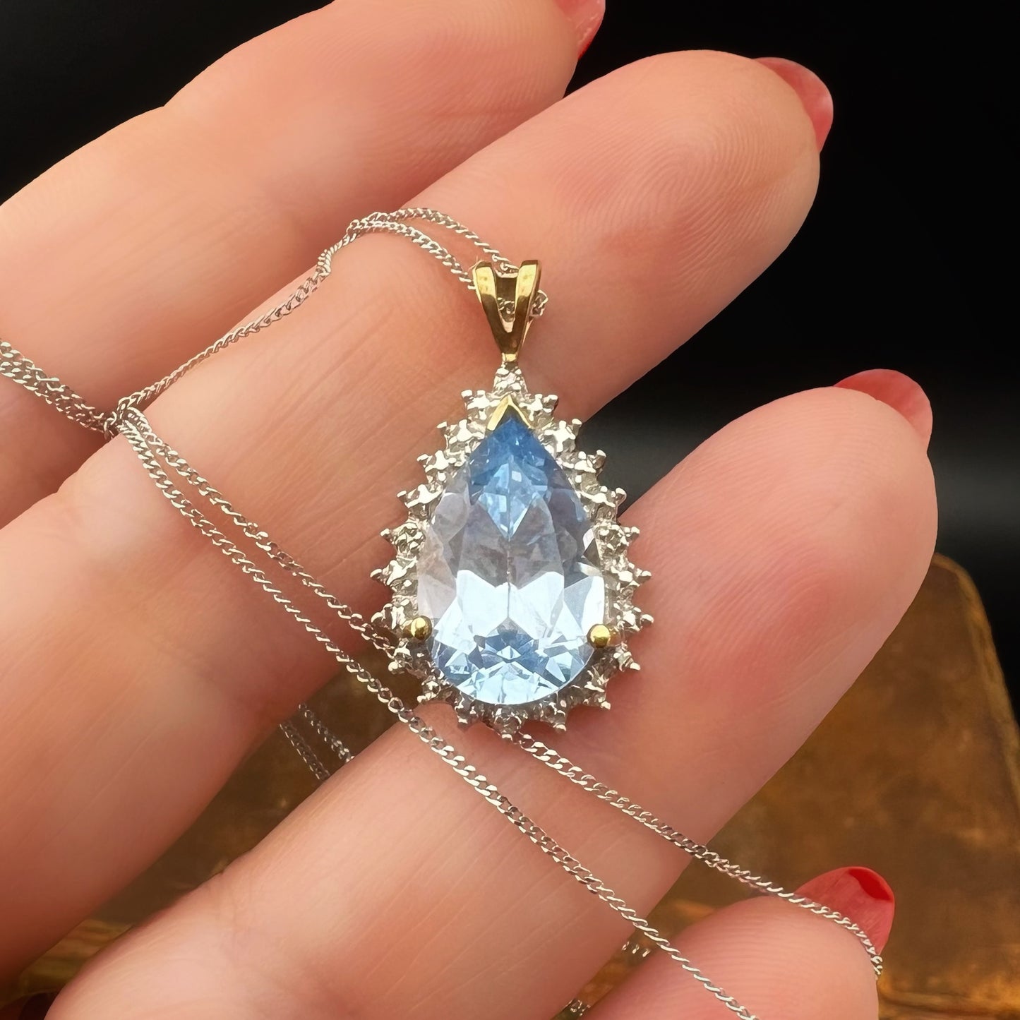 Blue topaz drop pendant with 4 small diamonds, 9ct gold