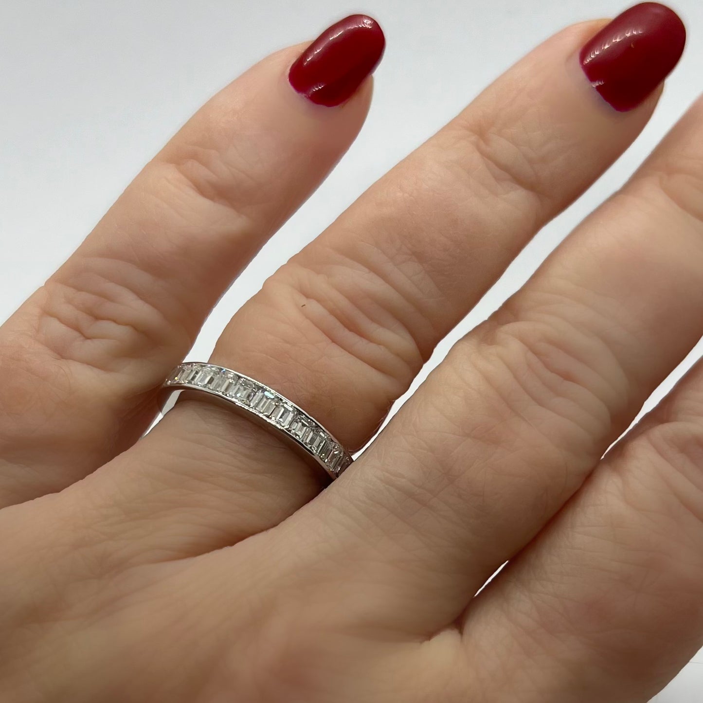 Eternity ring with emerald cut diamonds