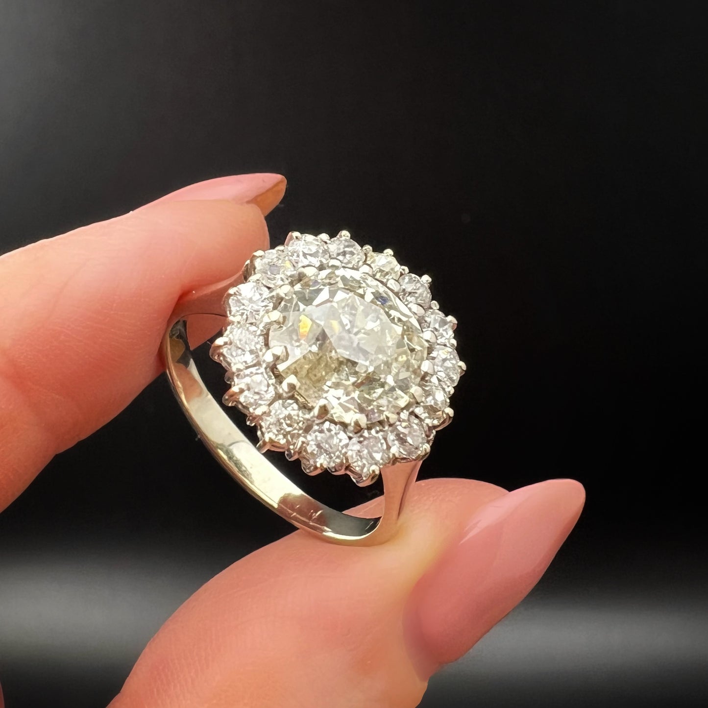 Ring with 4 ct old mine cut diamond plus 1 ct surround