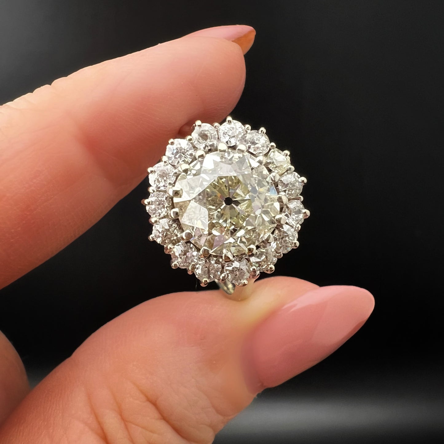 Ring with 4 ct old mine cut diamond plus 1 ct surround