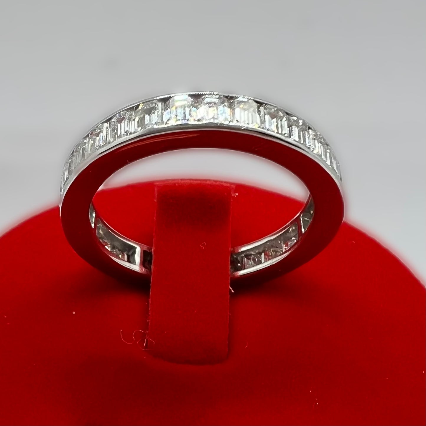 Eternity ring with emerald cut diamonds