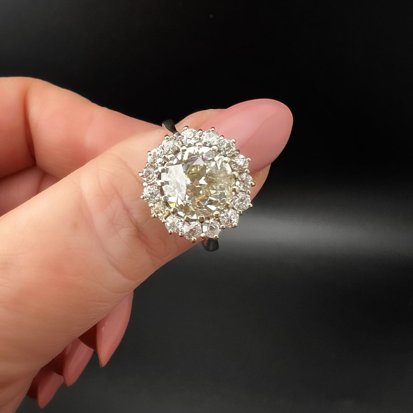 Ring with 4 ct old mine cut diamond plus 1 ct surround