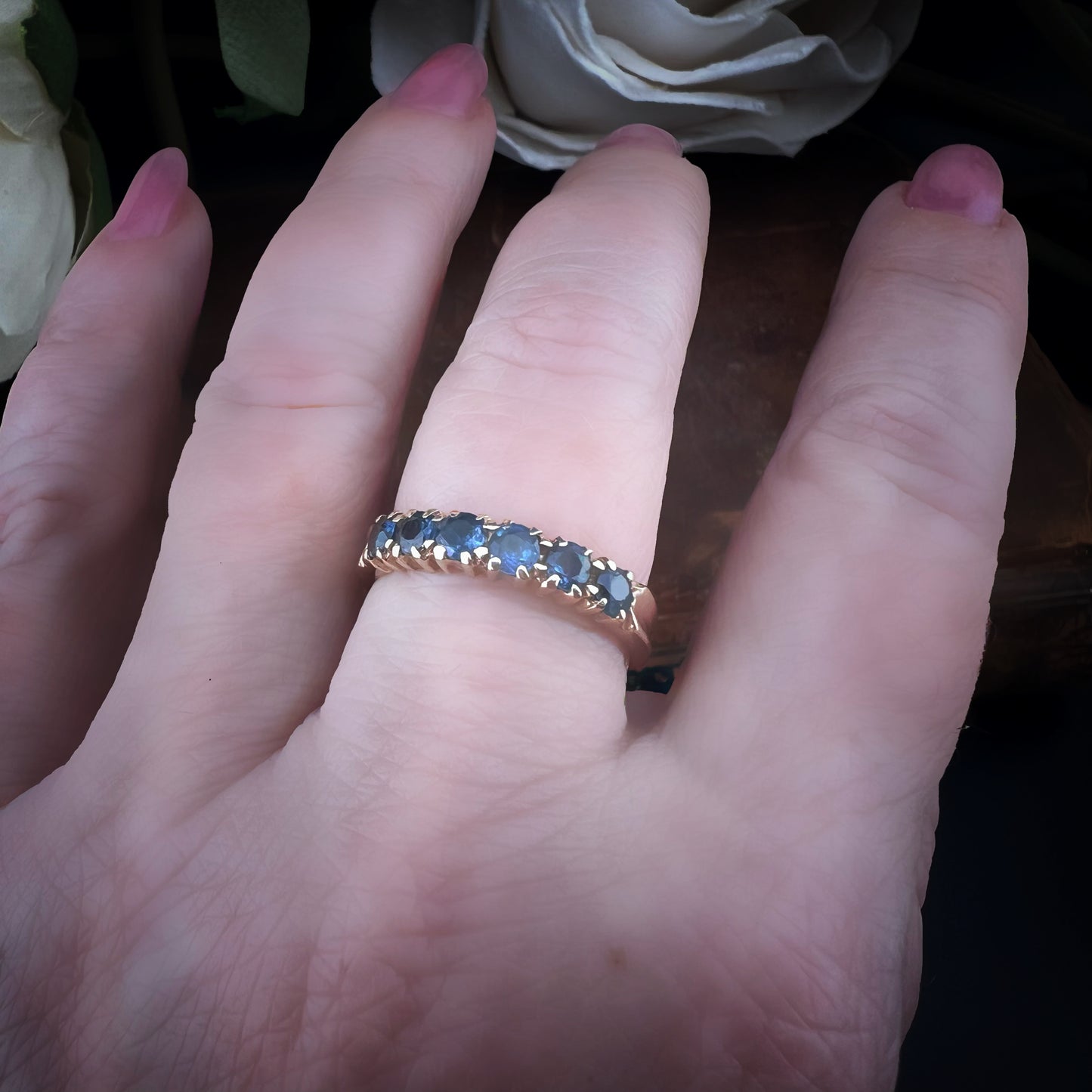Wedding ring with 6 blue sapphires
