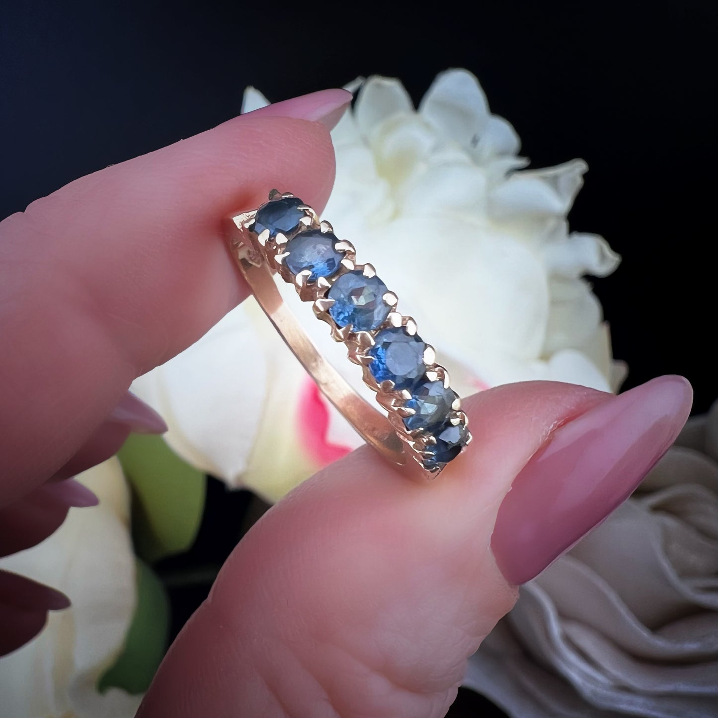 Wedding ring with 6 blue sapphires
