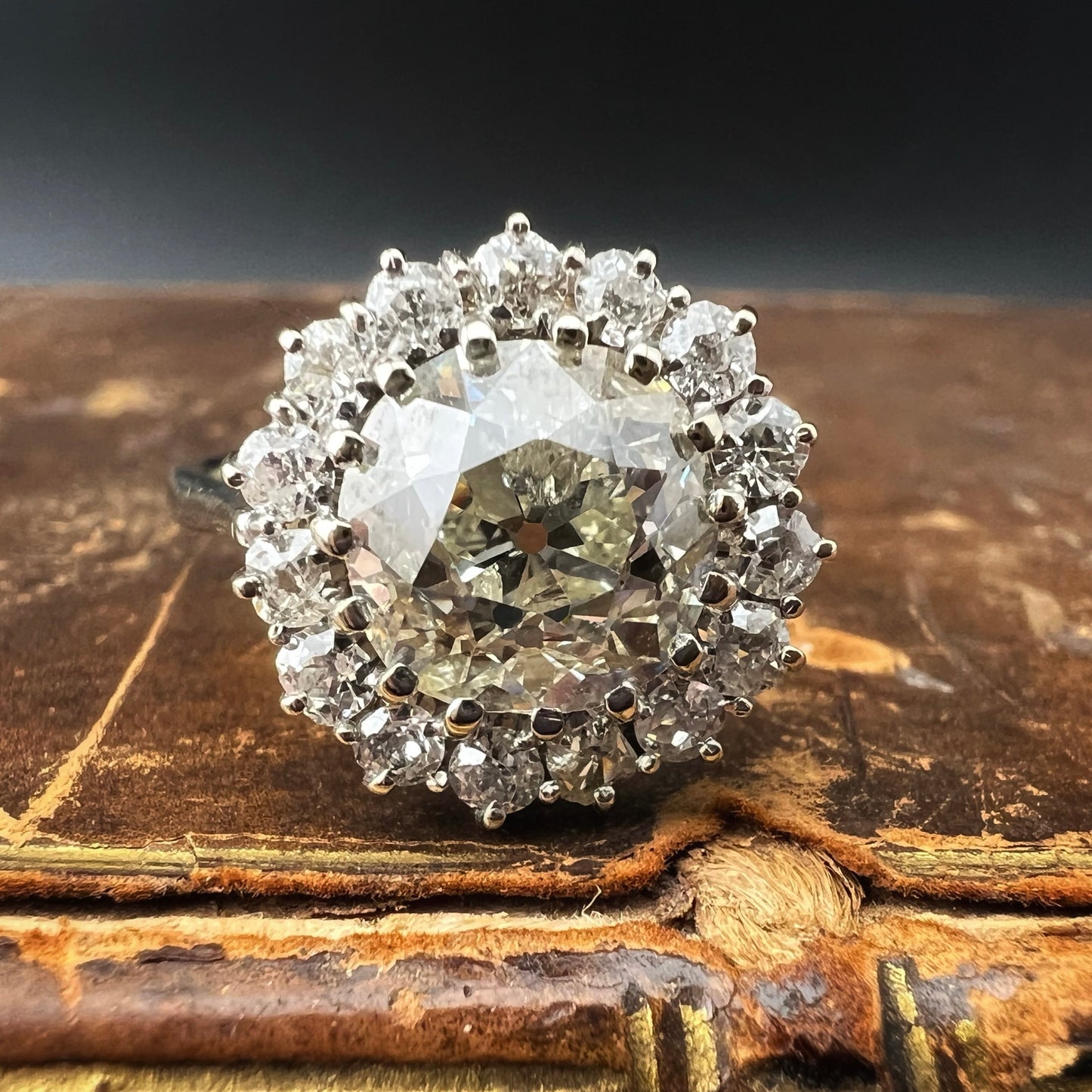 Ring with 4 ct old mine cut diamond plus 1 ct surround