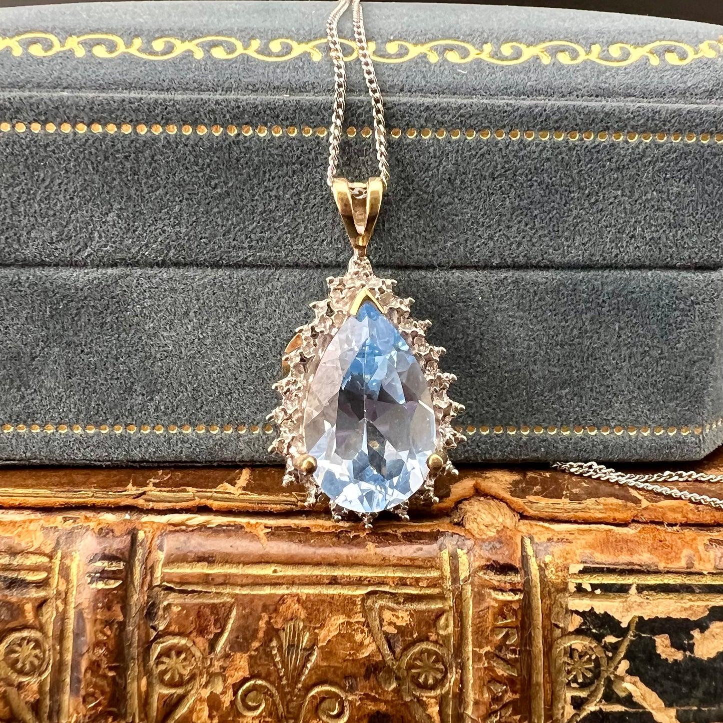 Blue topaz drop pendant with 4 small diamonds, 9ct gold