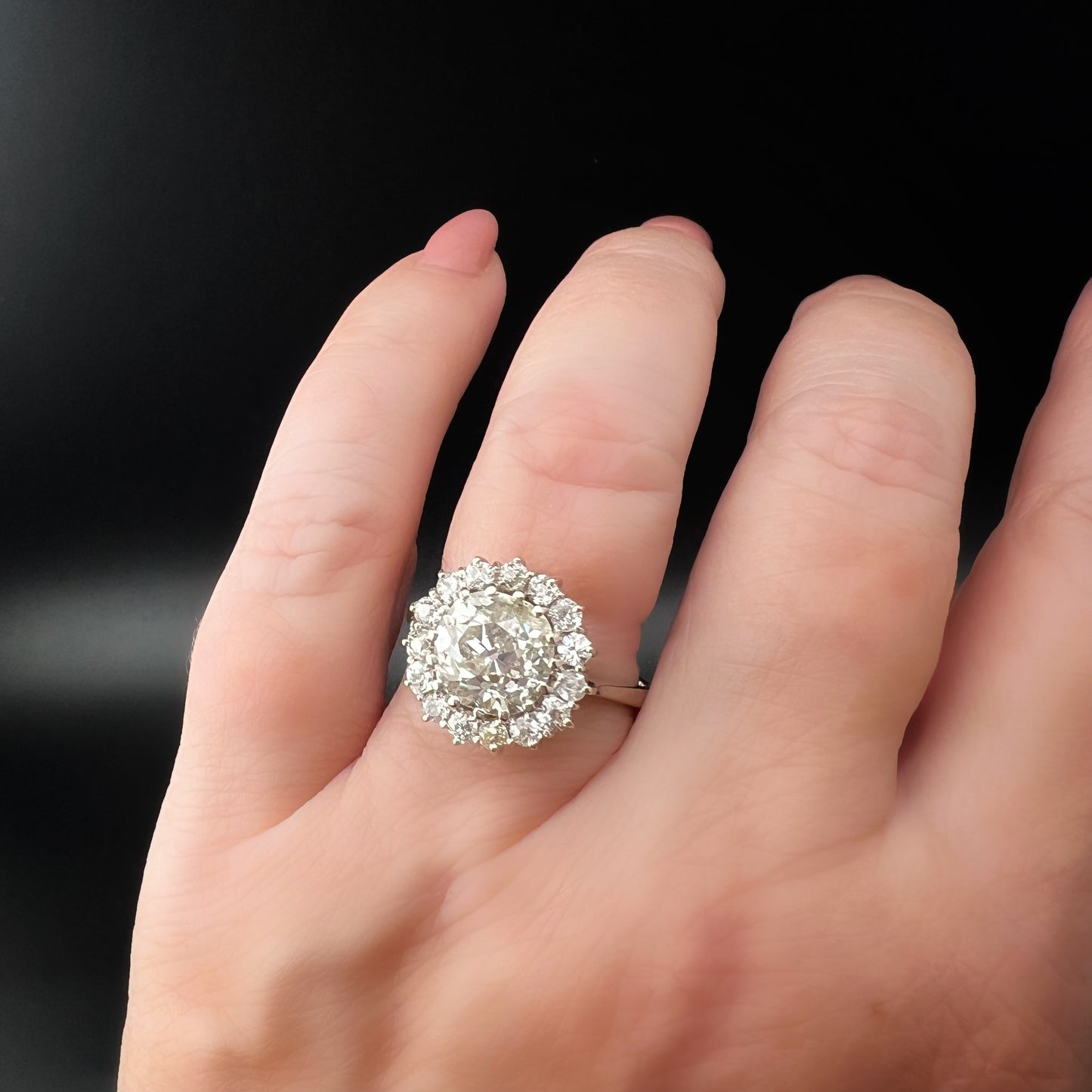 Ring with 4 ct old mine cut diamond plus 1 ct surround