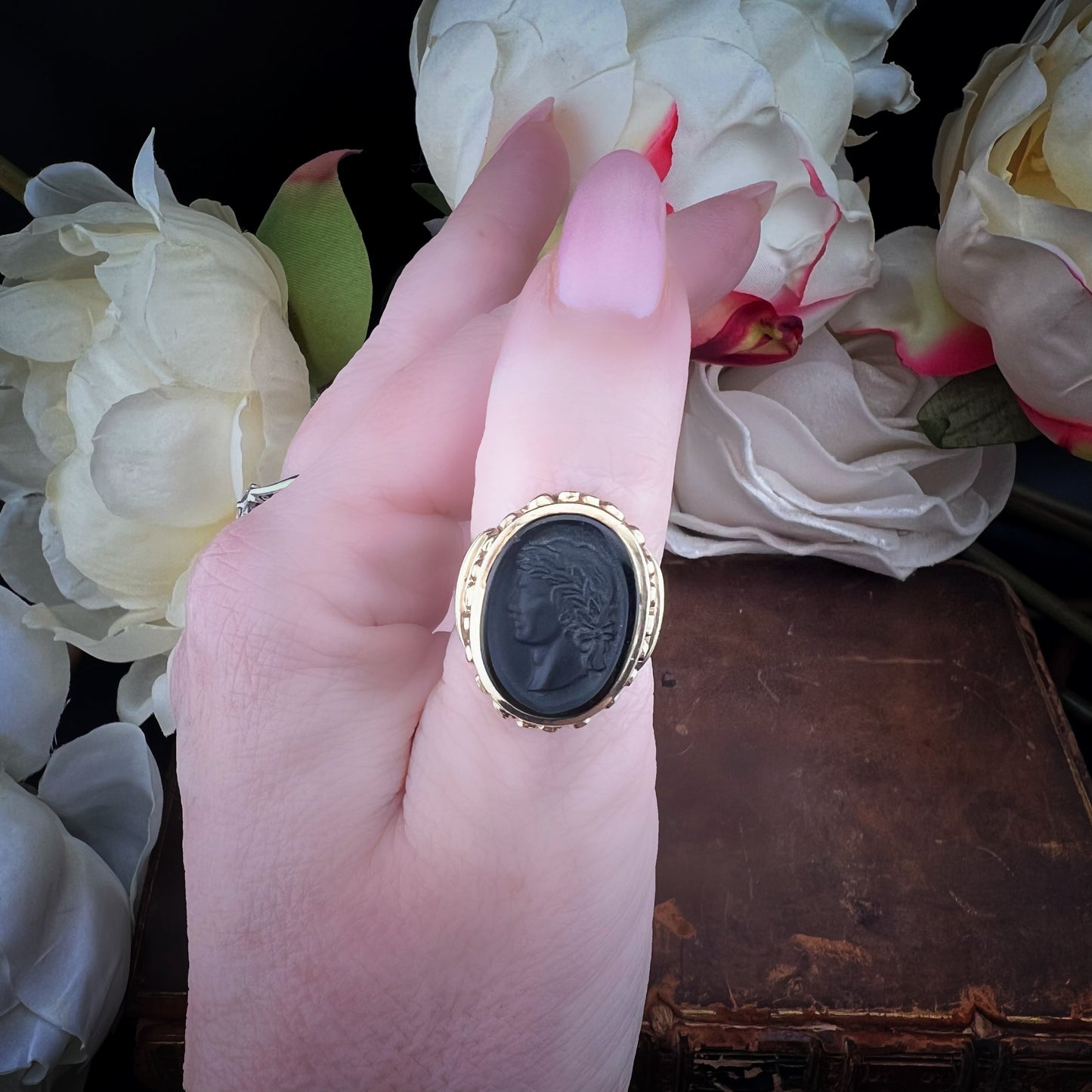 GOLD AND CARVED BASALT SIGNET RING – LONDON, 1972