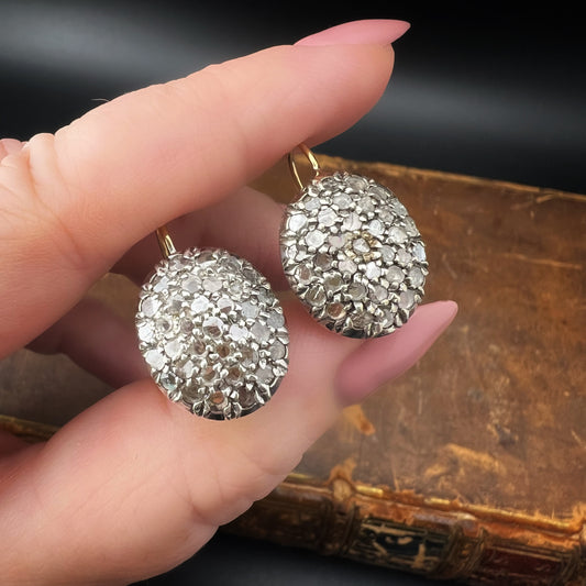 Pair of oval patch earrings, 18 ct gold, silver and diamond rosettes