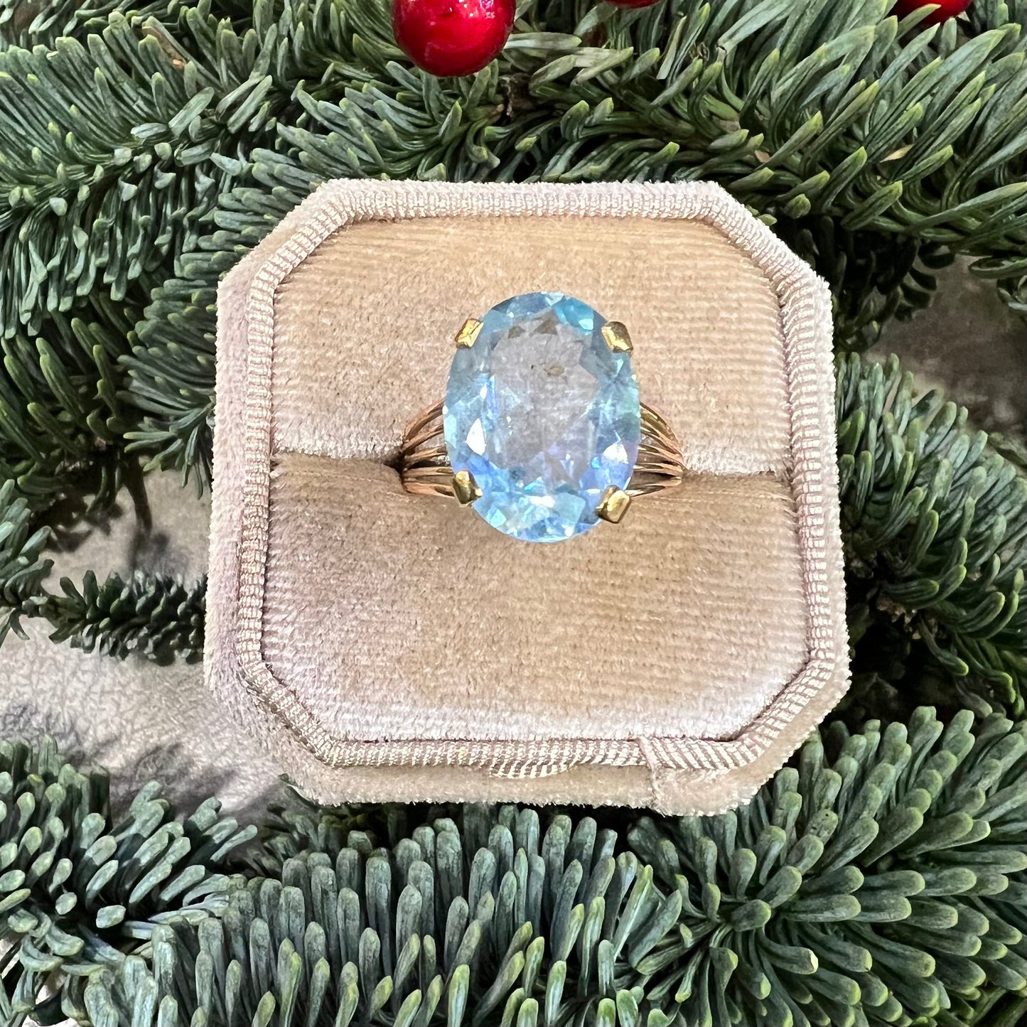 Cocktail ring with blue topaz and 14k yellow gold