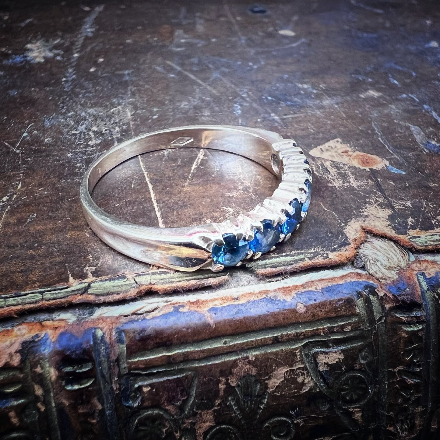 Wedding ring with 6 blue sapphires