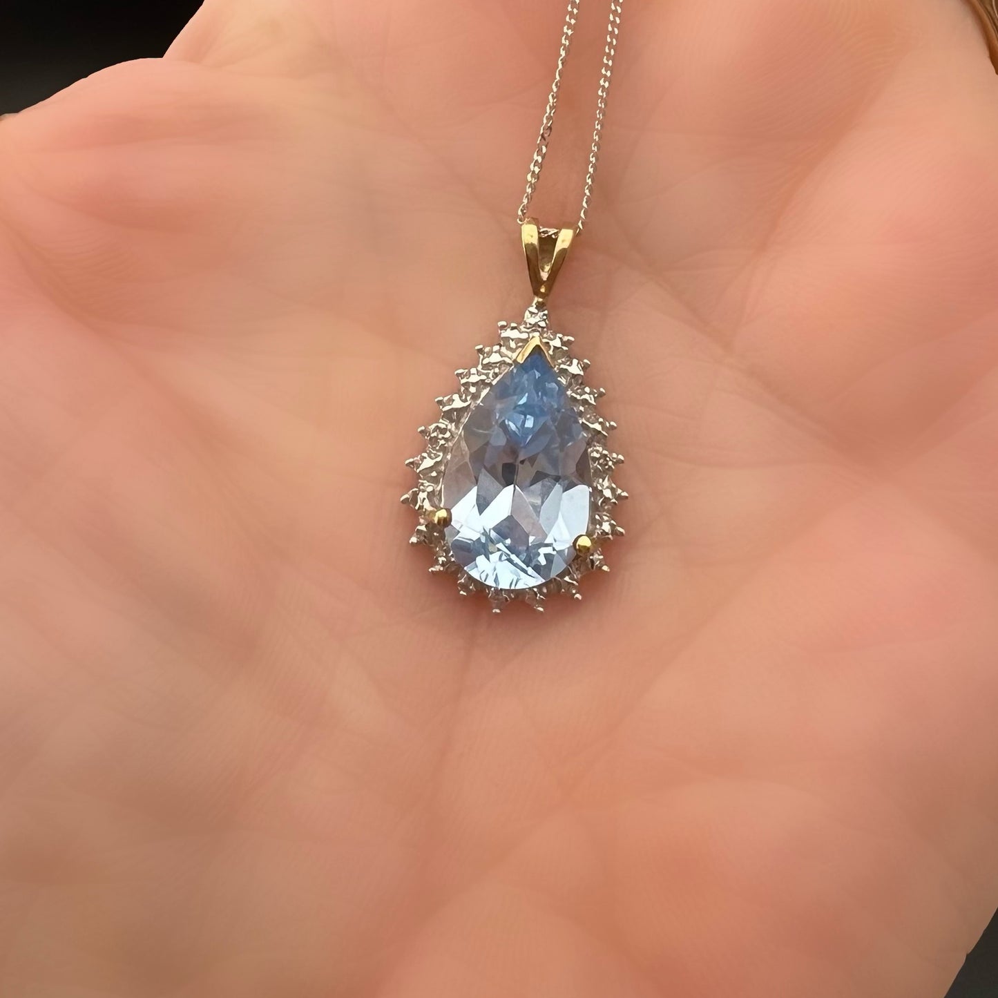 Blue topaz drop pendant with 4 small diamonds, 9ct gold