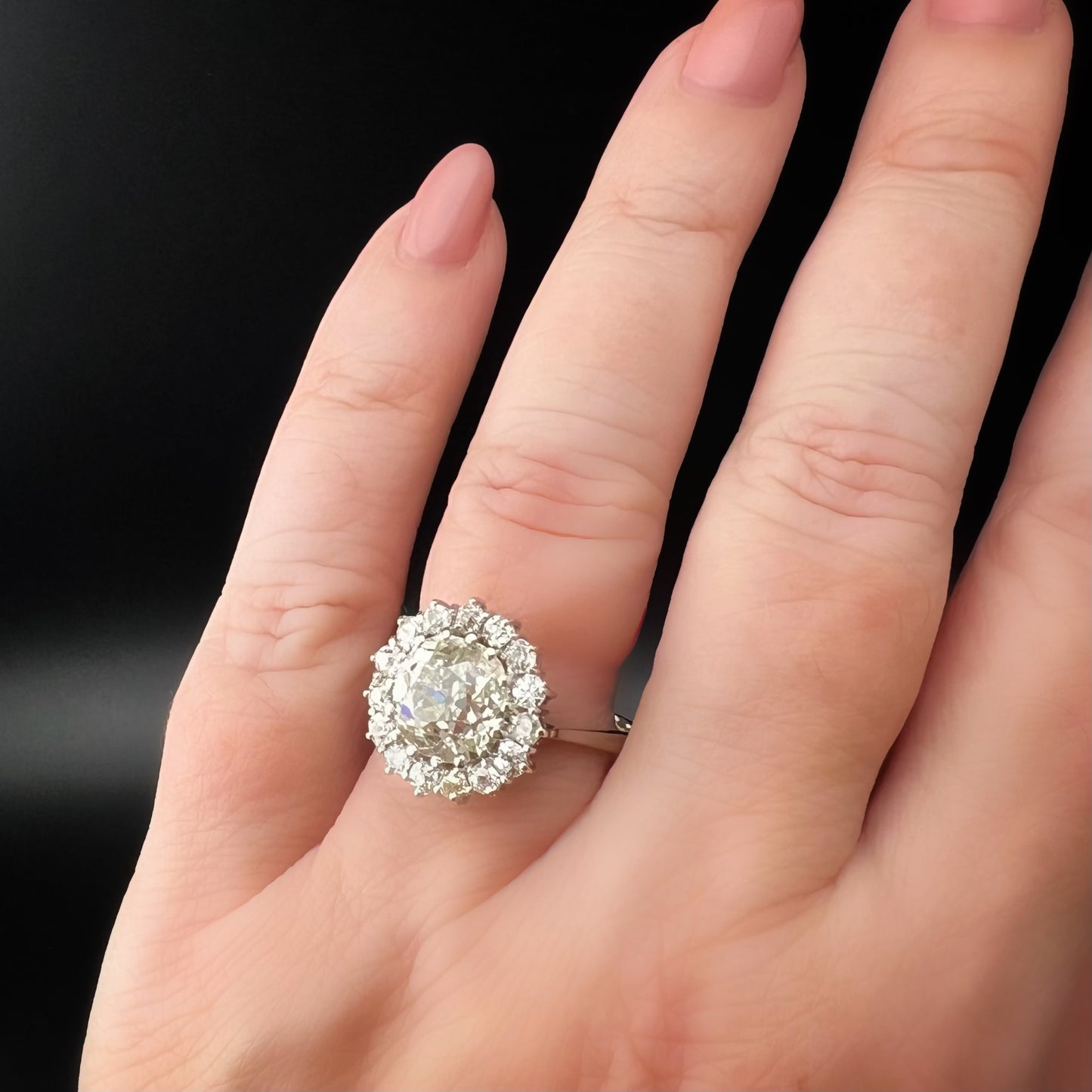 Ring with 4 ct old mine cut diamond plus 1 ct surround