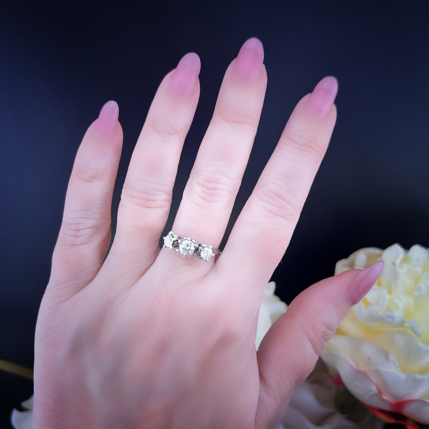 18K white gold and diamond trilogy ring. Italy, c. 1920.