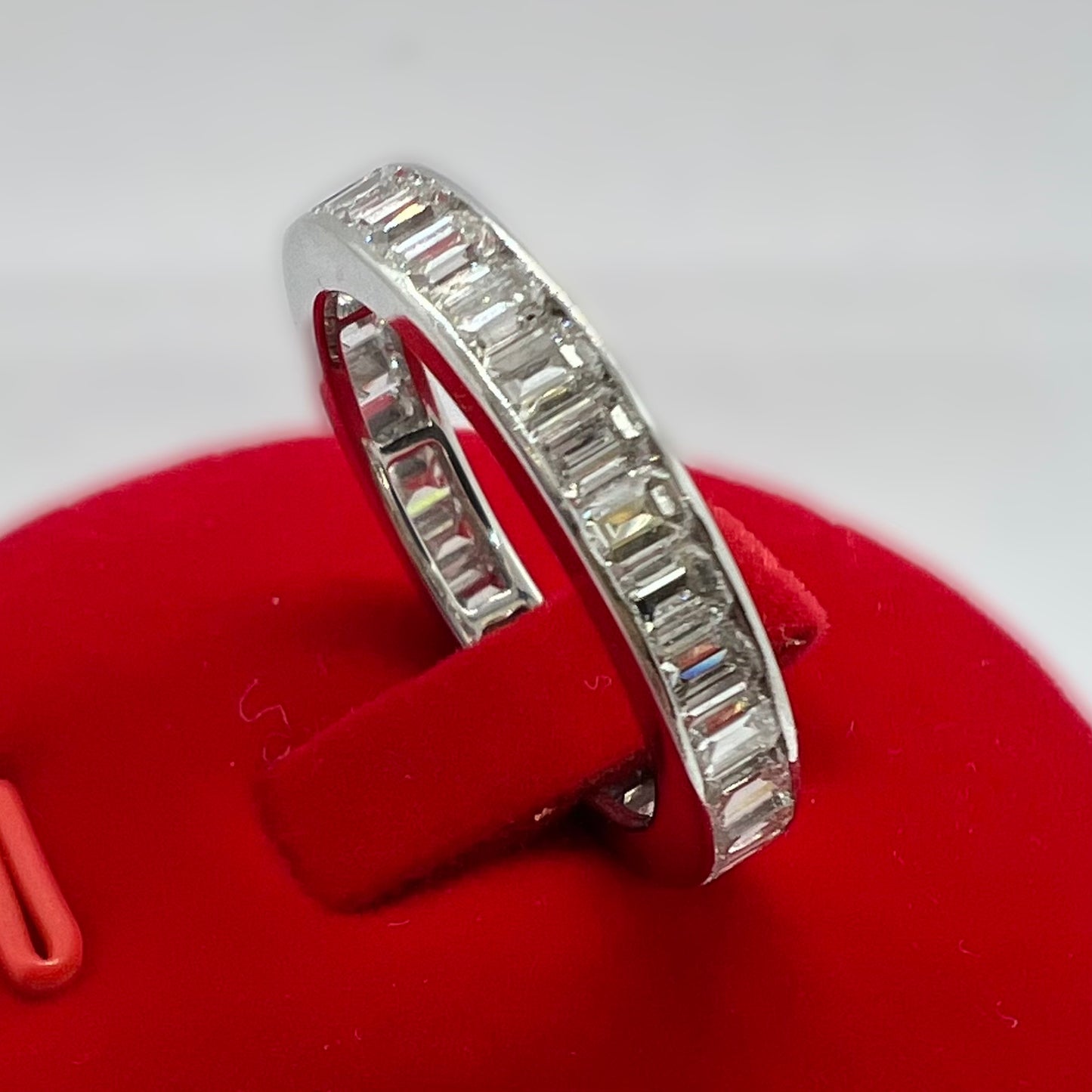 Eternity ring with emerald cut diamonds