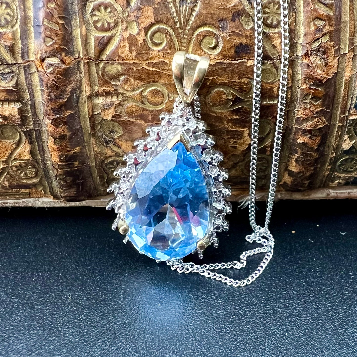 Blue topaz drop pendant with 4 small diamonds, 9ct gold