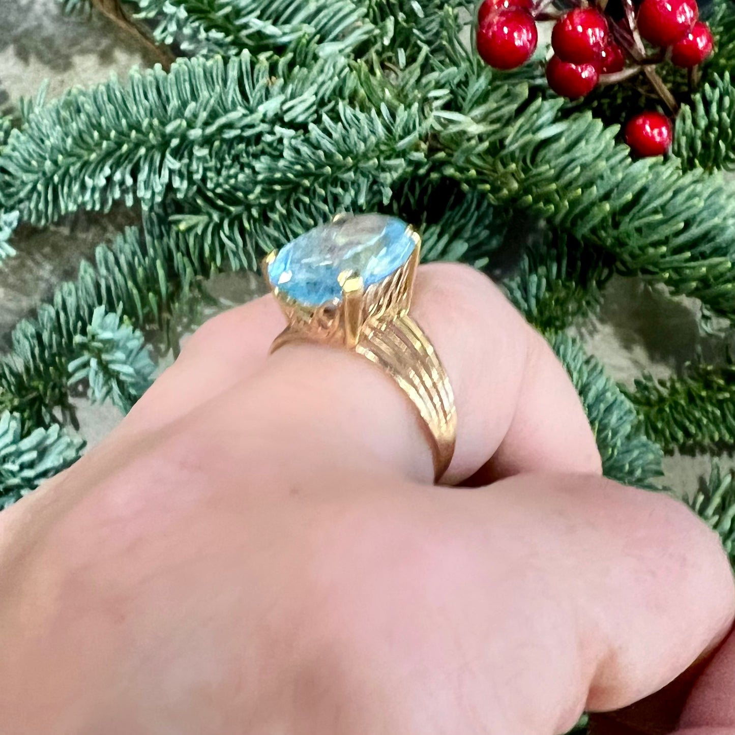 Cocktail ring with blue topaz and 14k yellow gold