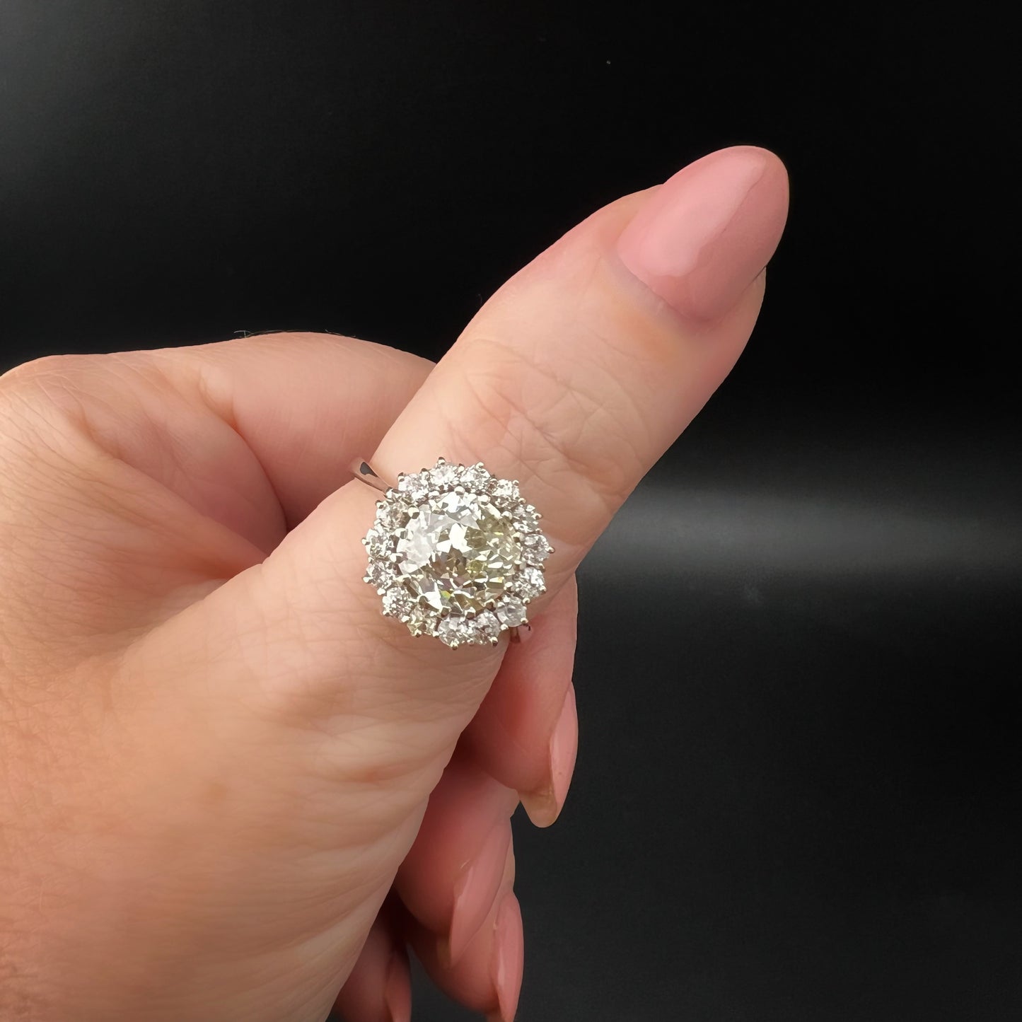 Ring with 4 ct old mine cut diamond plus 1 ct surround