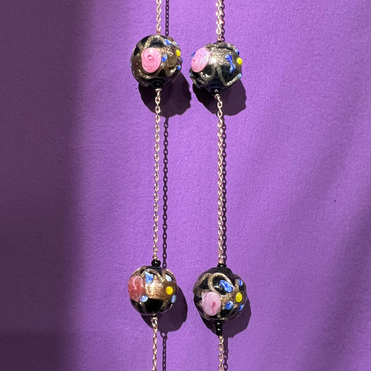 Long necklace with ancient black “flowered” Venetian pearls