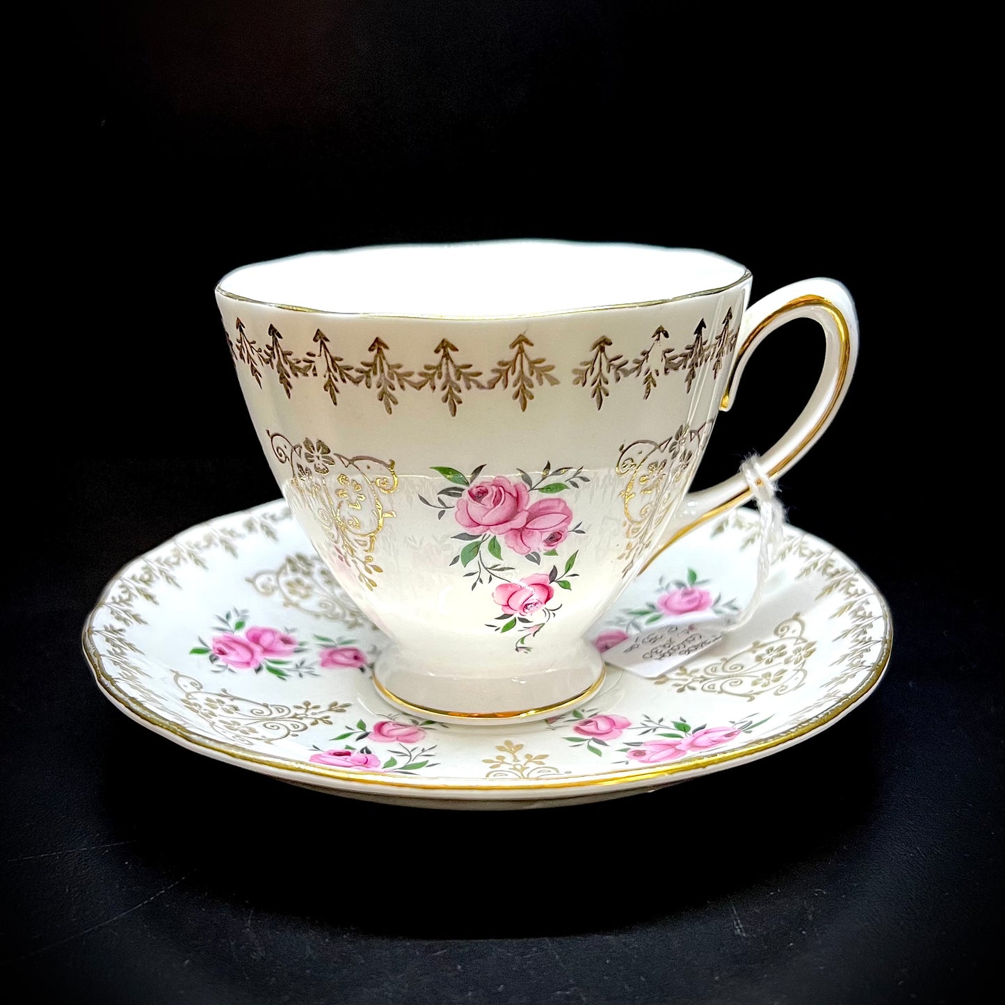 Tea cup and saucer with early 1900s rose decoration