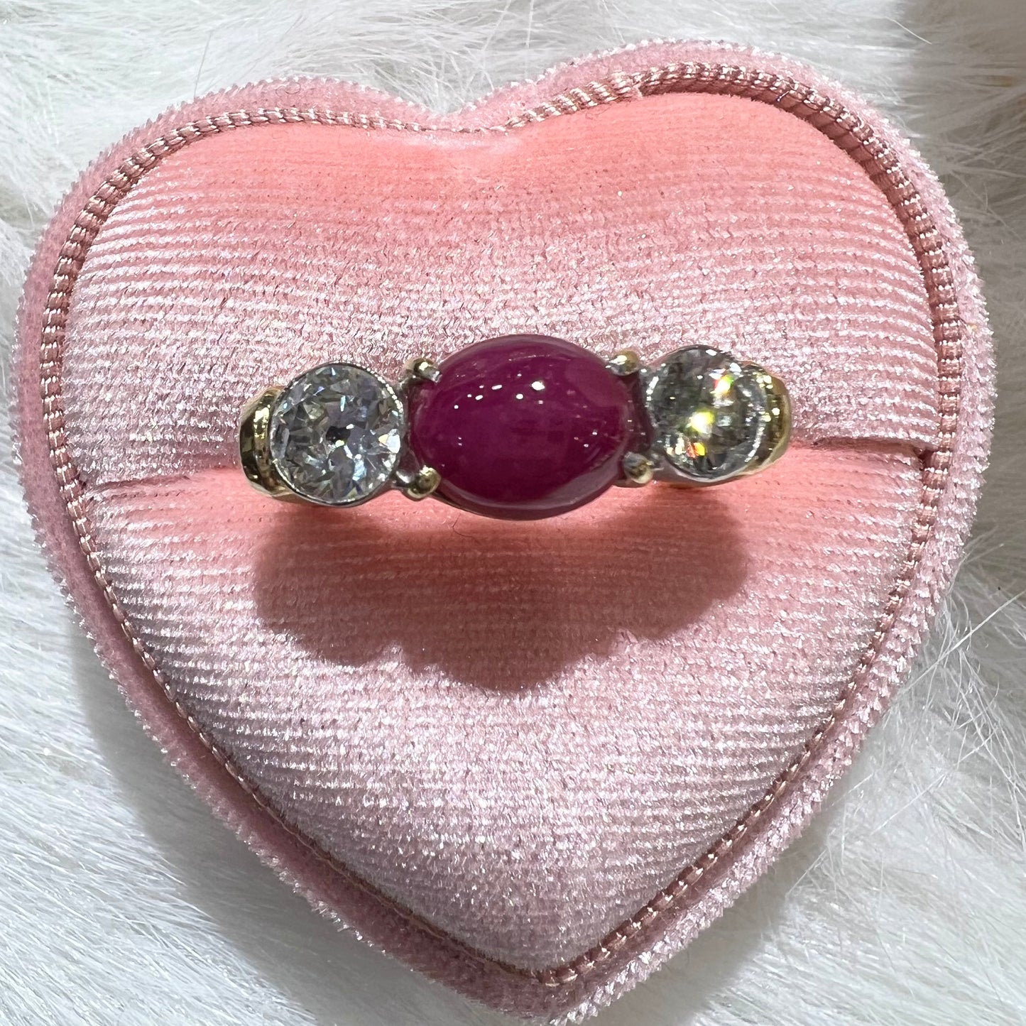 Ring with two diamonds and central cabochon ruby