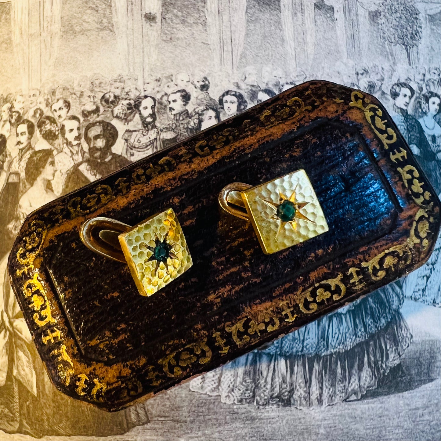 Pair of gold and emerald firing buttons