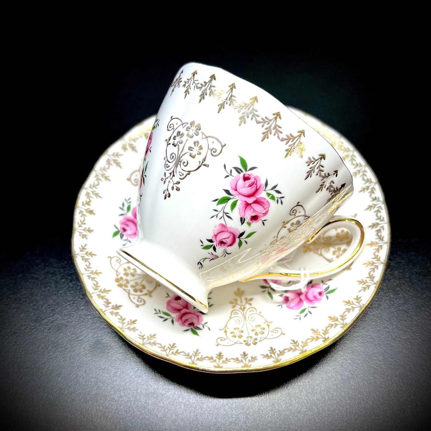 Tea cup and saucer with early 1900s rose decoration