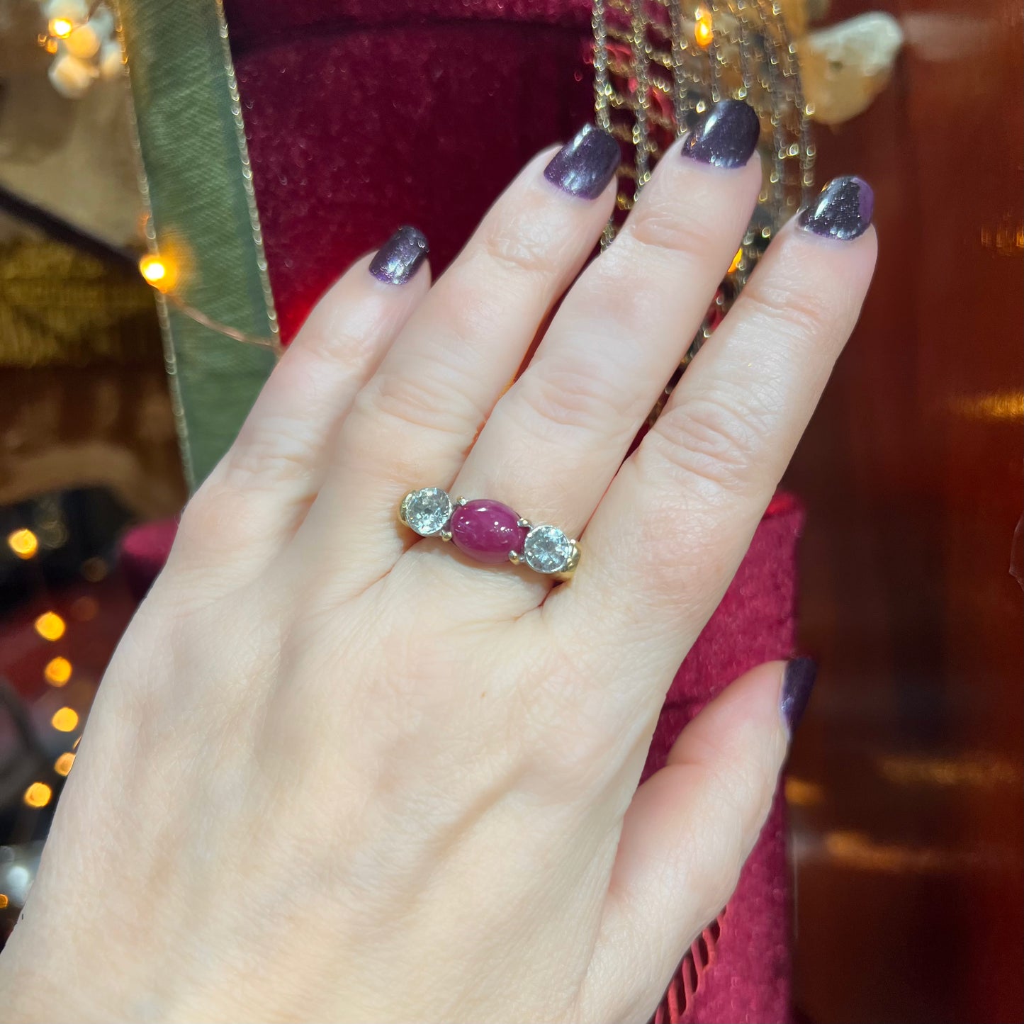 Ring with two diamonds and central cabochon ruby