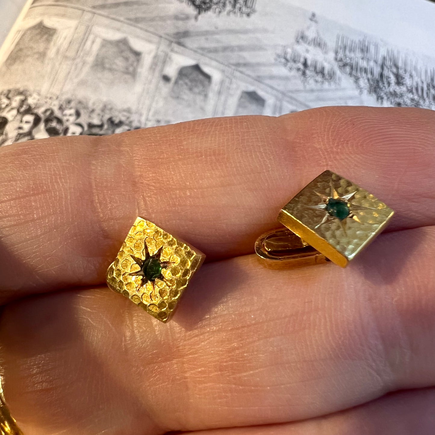 Pair of gold and emerald firing buttons