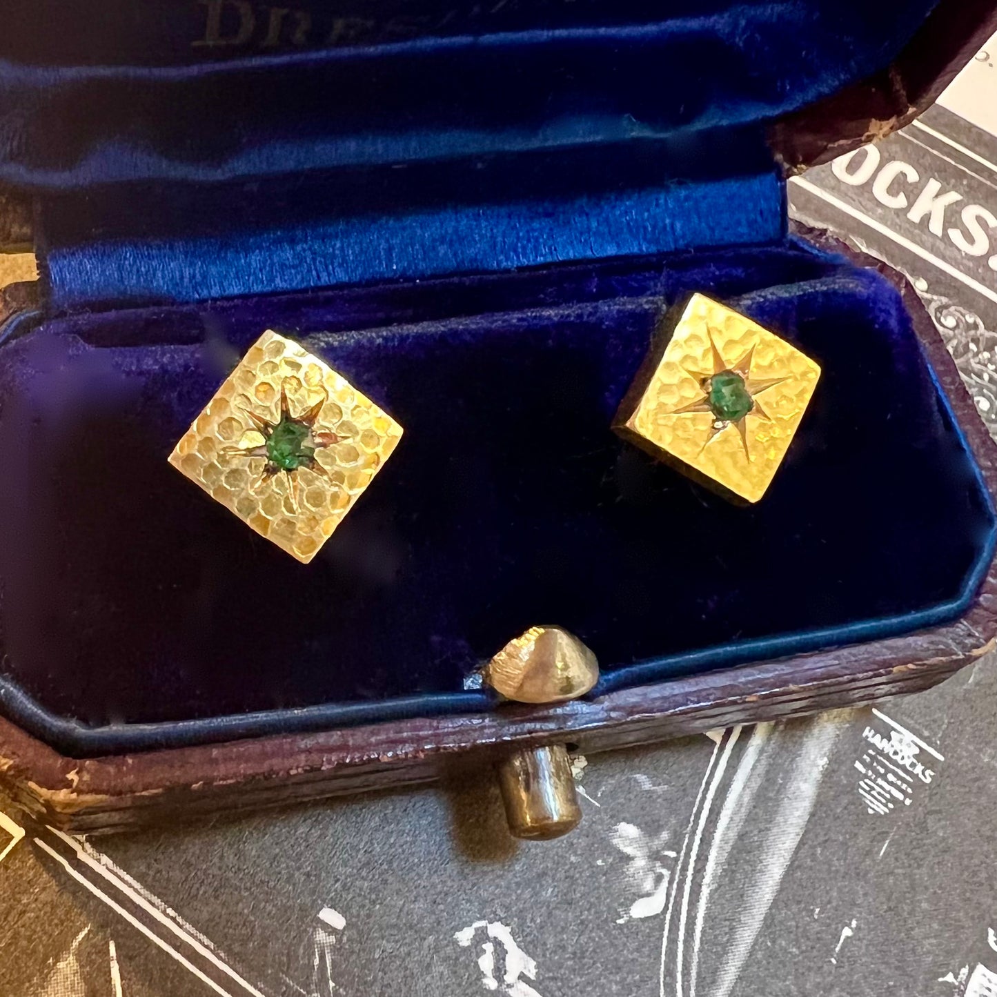 Pair of gold and emerald firing buttons