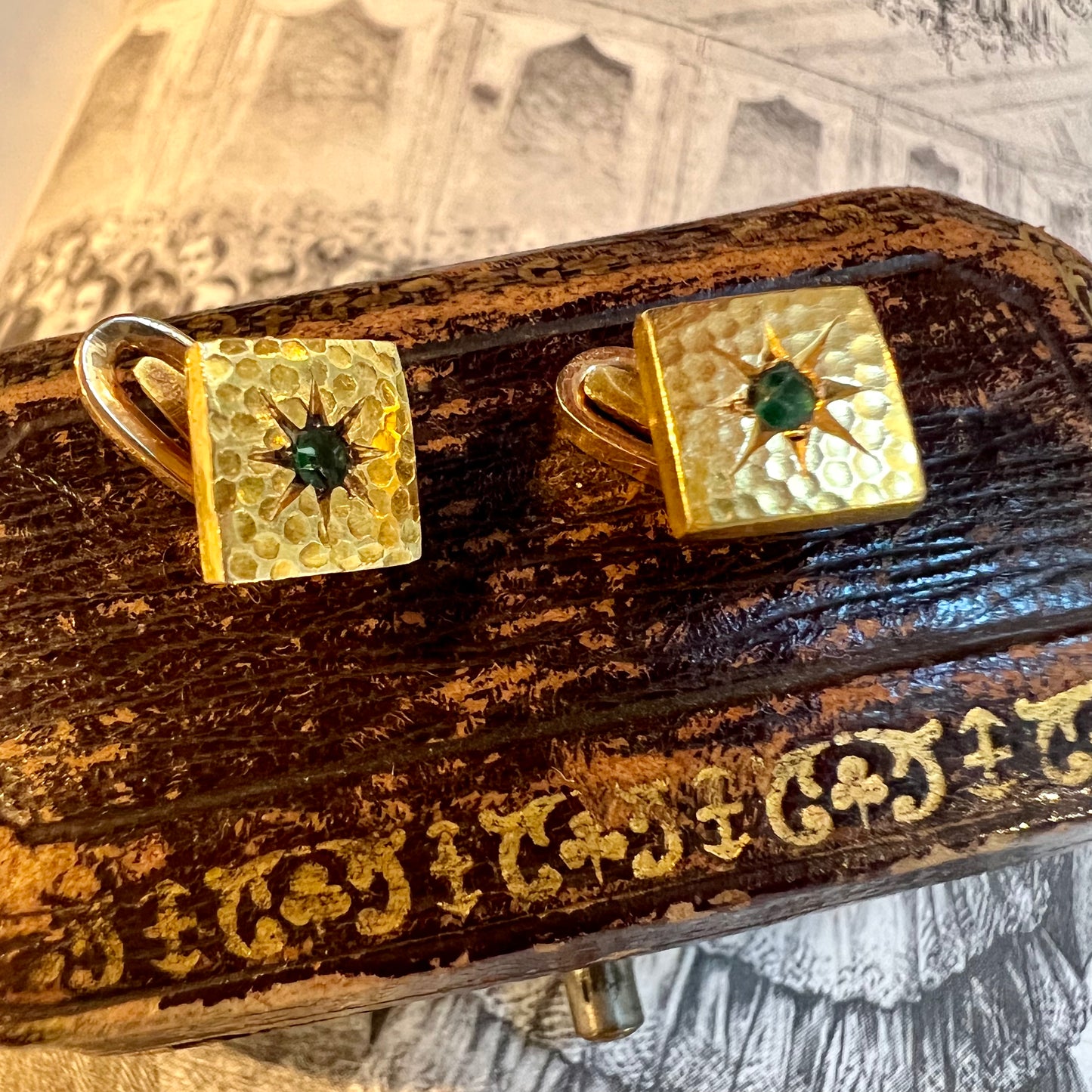 Pair of gold and emerald firing buttons