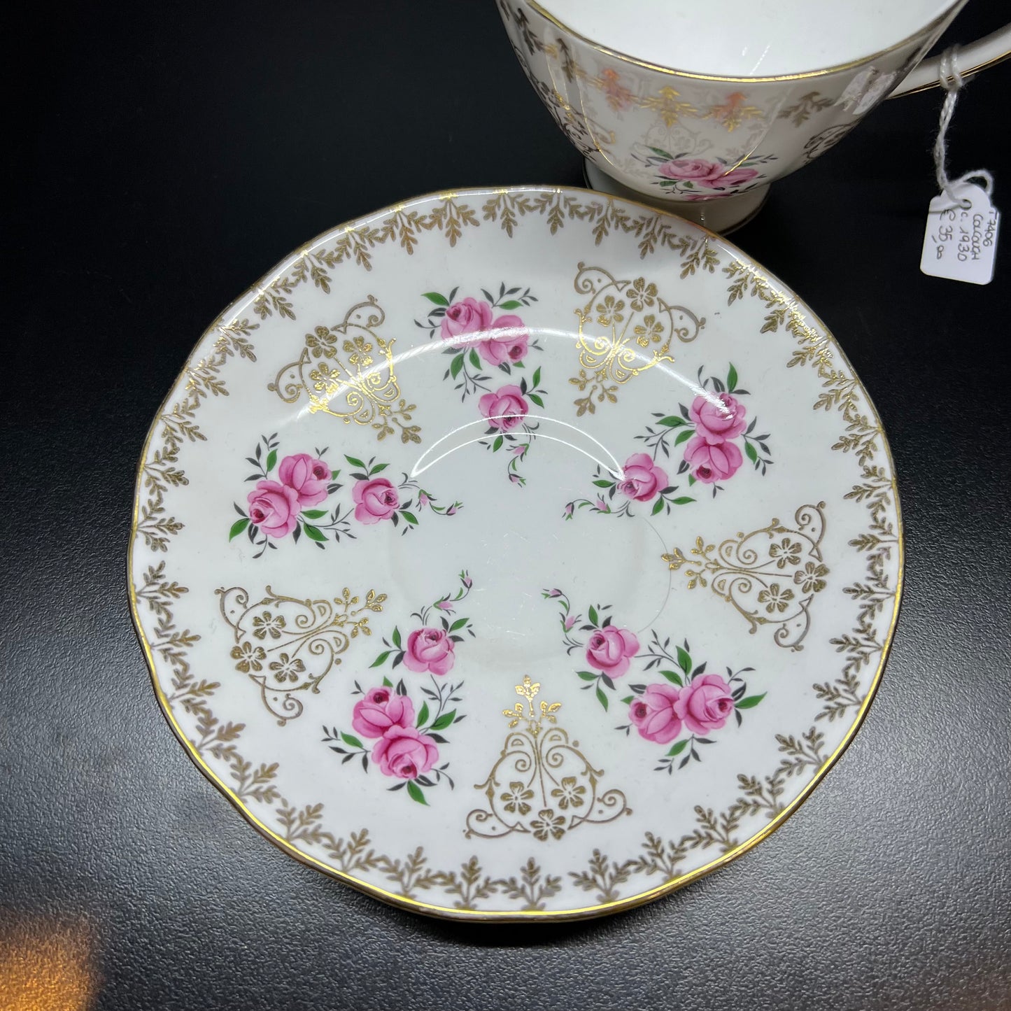 Tea cup and saucer with early 1900s rose decoration