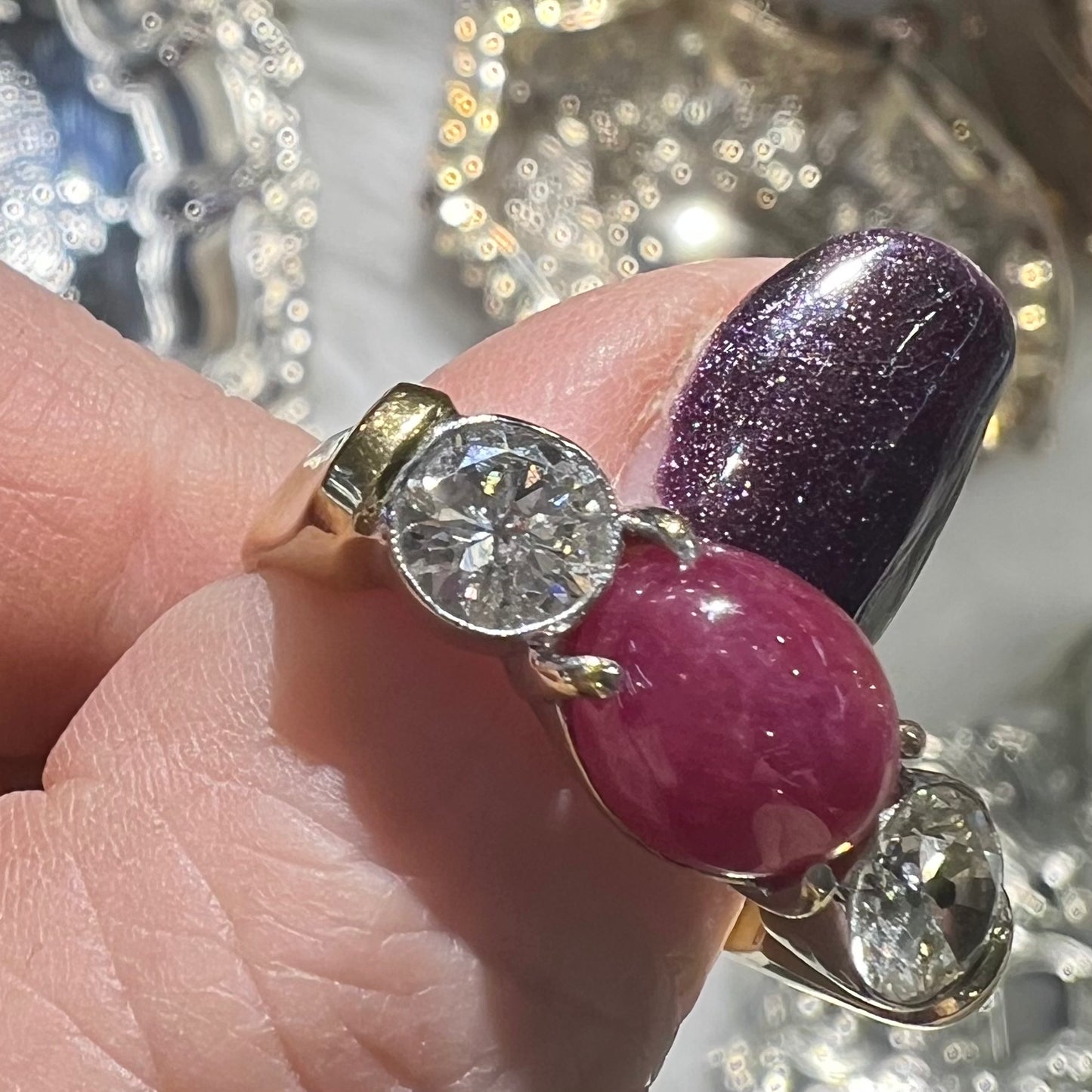 Ring with two diamonds and central cabochon ruby