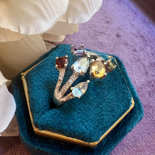 Vintage ring in white gold and colored gems: citrine, amethyst, garnet, blue topaz