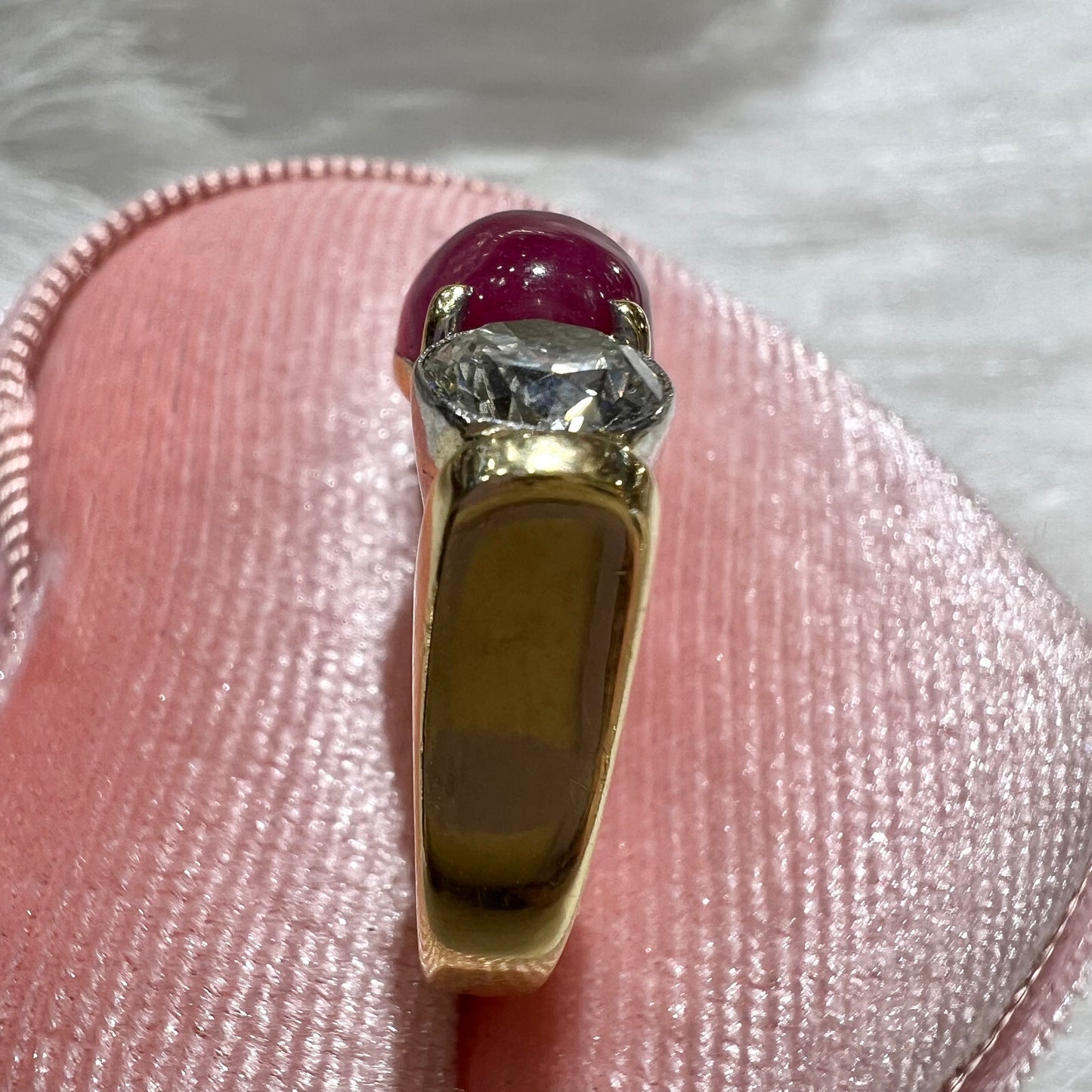 Ring with two diamonds and central cabochon ruby