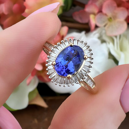 Anello vintage a margherita con tanzanite e diamanti baguette in oro giallo