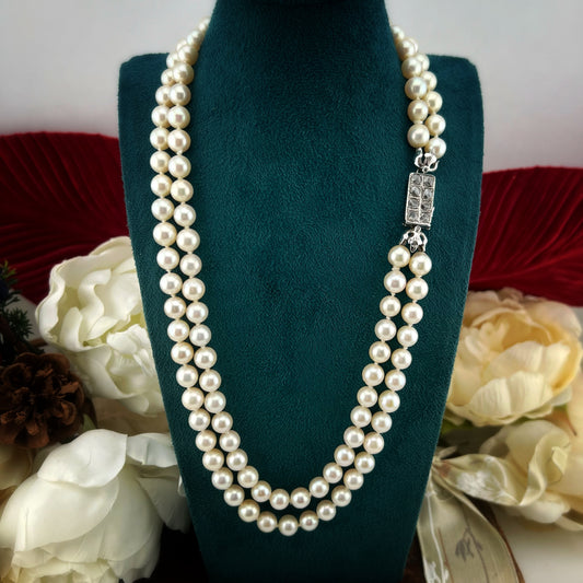 Collana a doppio filo di perle chiusura in oro bianco 18k e diamanti rosa coroné. Italia anni 20