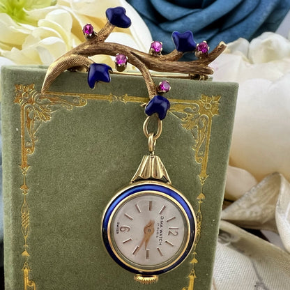 Orologino (brooch watch) in oro 18k rubini e smalti. Italia 1950-60