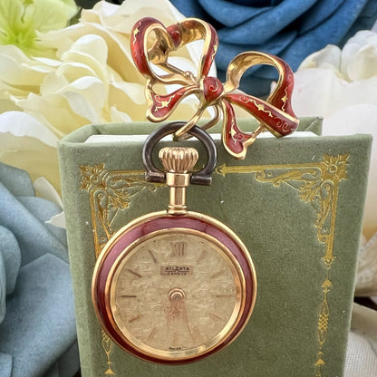Orologino spilla (brooch watch) in oro 18 k e smalti. Italia 1950