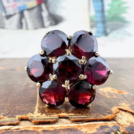 Anello vintage a grande margherita in oro e granati Londra 1975